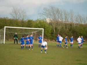 Carrigtwohill prepare against a free kick