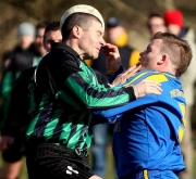 Carrig's Niall Kidney (right) and ex Cork City ace Fergus O'Donoghue in close combat during last weekend's St Michael's Cup semi-final that Mayfield won 1-0. Both sides are in action tomorrow (Sat), Carrig at home to Los Zarcos in the County Cup, Mayfield away to Ballyvolane in 1B. Picture taken at Slatty Park, 04.03.06, Billy Lyons